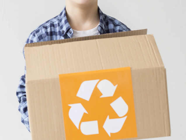 portrait-cute-young-boy-holding-recycling-box